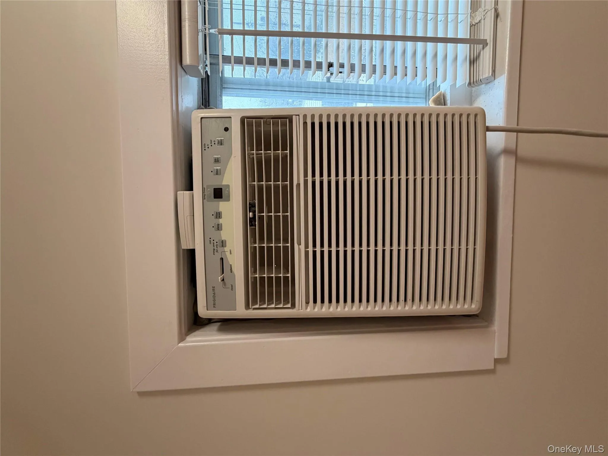 Detailed view of an AC wall unit and cooling unit Detailed view of an AC wall unit and cooling unit