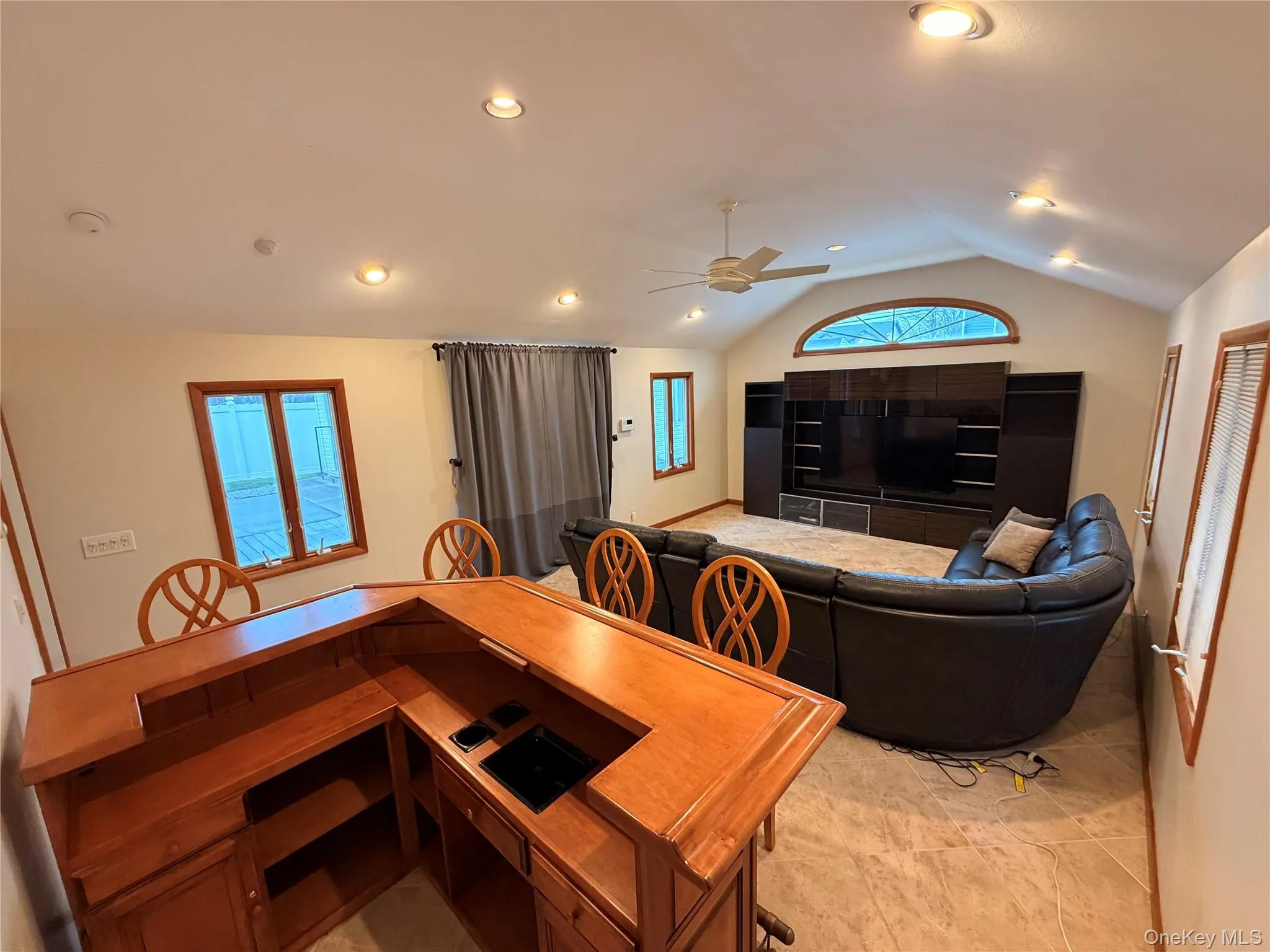 Dining area with vaulted ceiling, ceiling fan, and recessed lighting Dining area with vaulted ceiling, ceiling fan, and recessed lighting