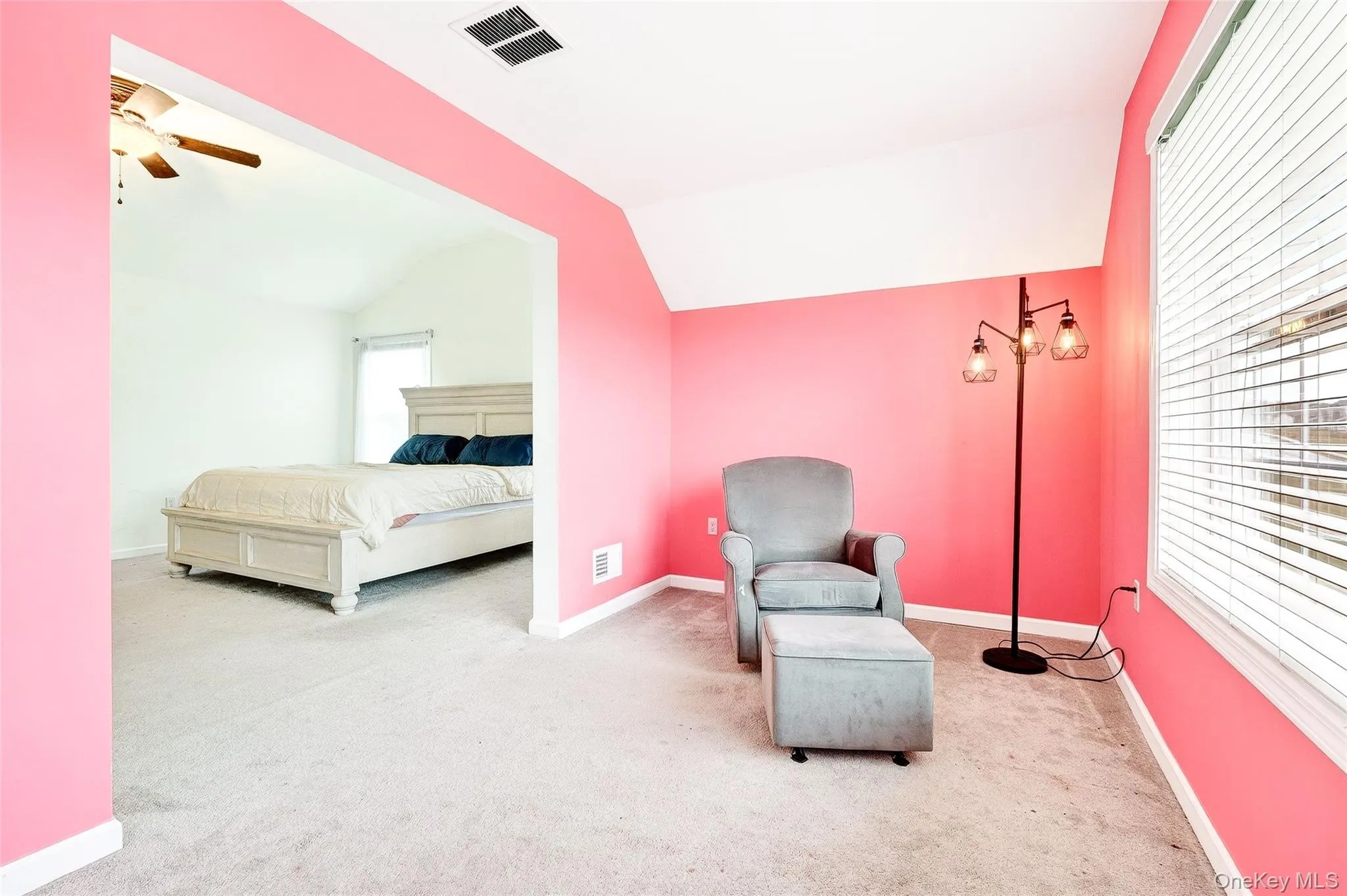 Sitting room with light carpet and vaulted ceiling Sitting room with light carpet and vaulted ceiling