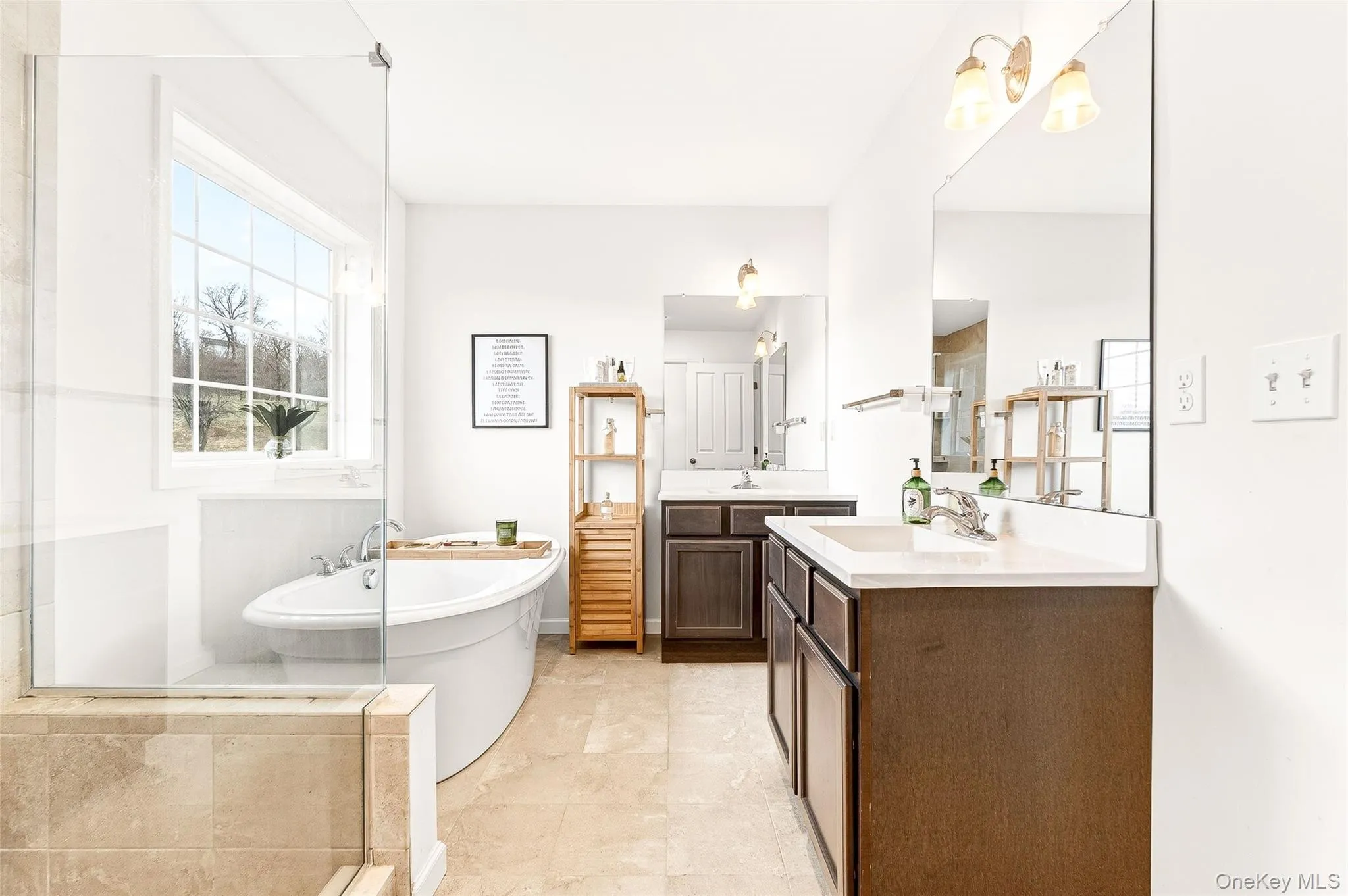 Full bath with a soaking tub, two vanities, and a stall shower Full bath with a soaking tub, two vanities, and a stall shower