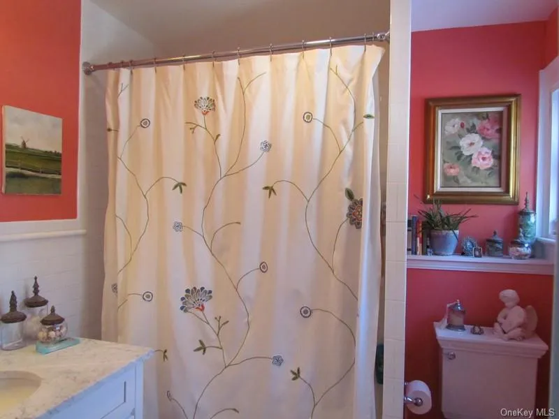 Bathroom featuring walk in shower and vanity Bathroom featuring walk in shower and vanity