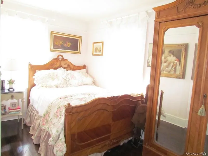 Bedroom featuring dark wood-type flooring Bedroom featuring dark wood-type flooring