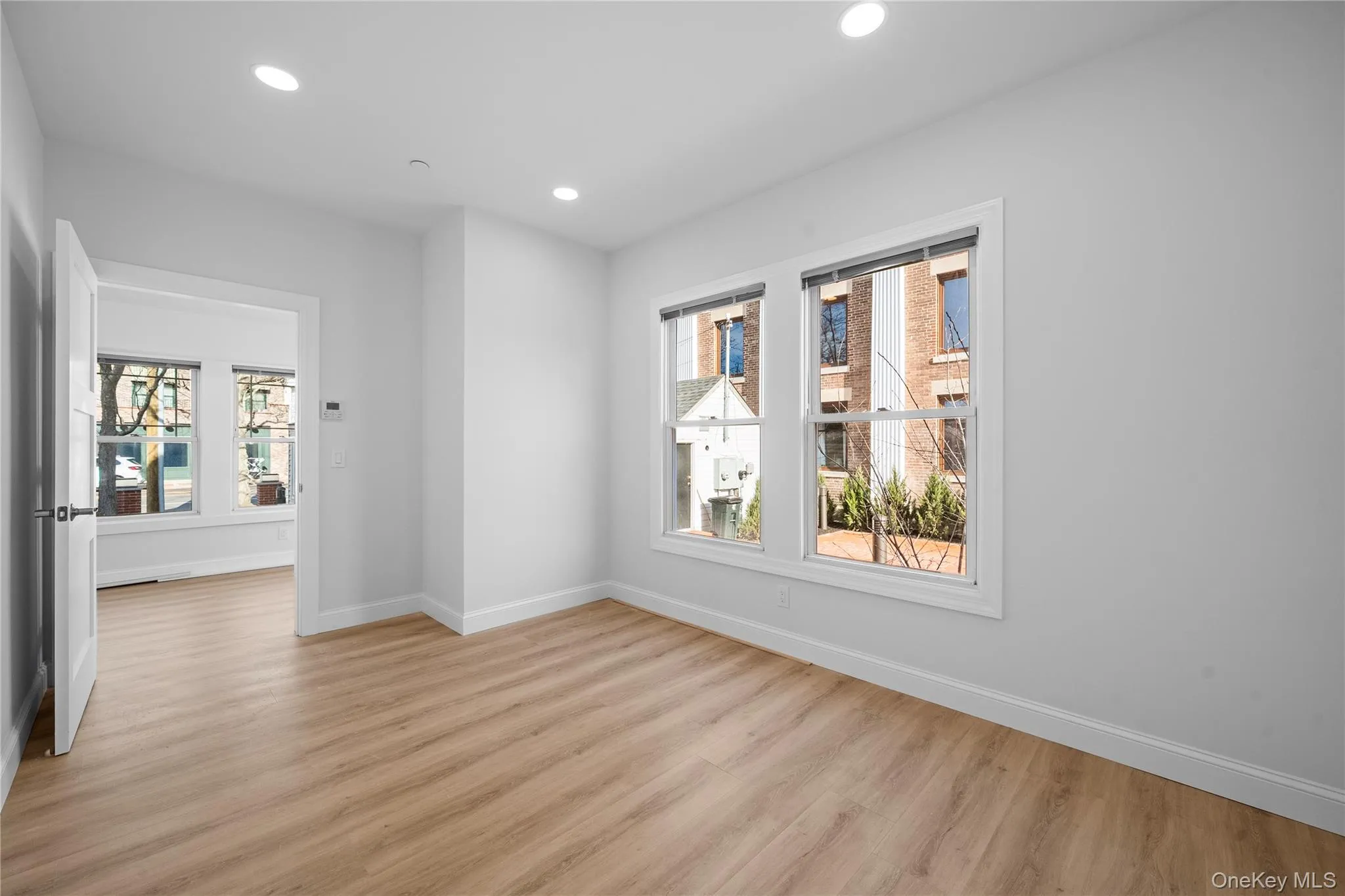 Unfurnished room featuring light wood-style floors and recessed lighting Unfurnished room featuring light wood-style floors and recessed lighting