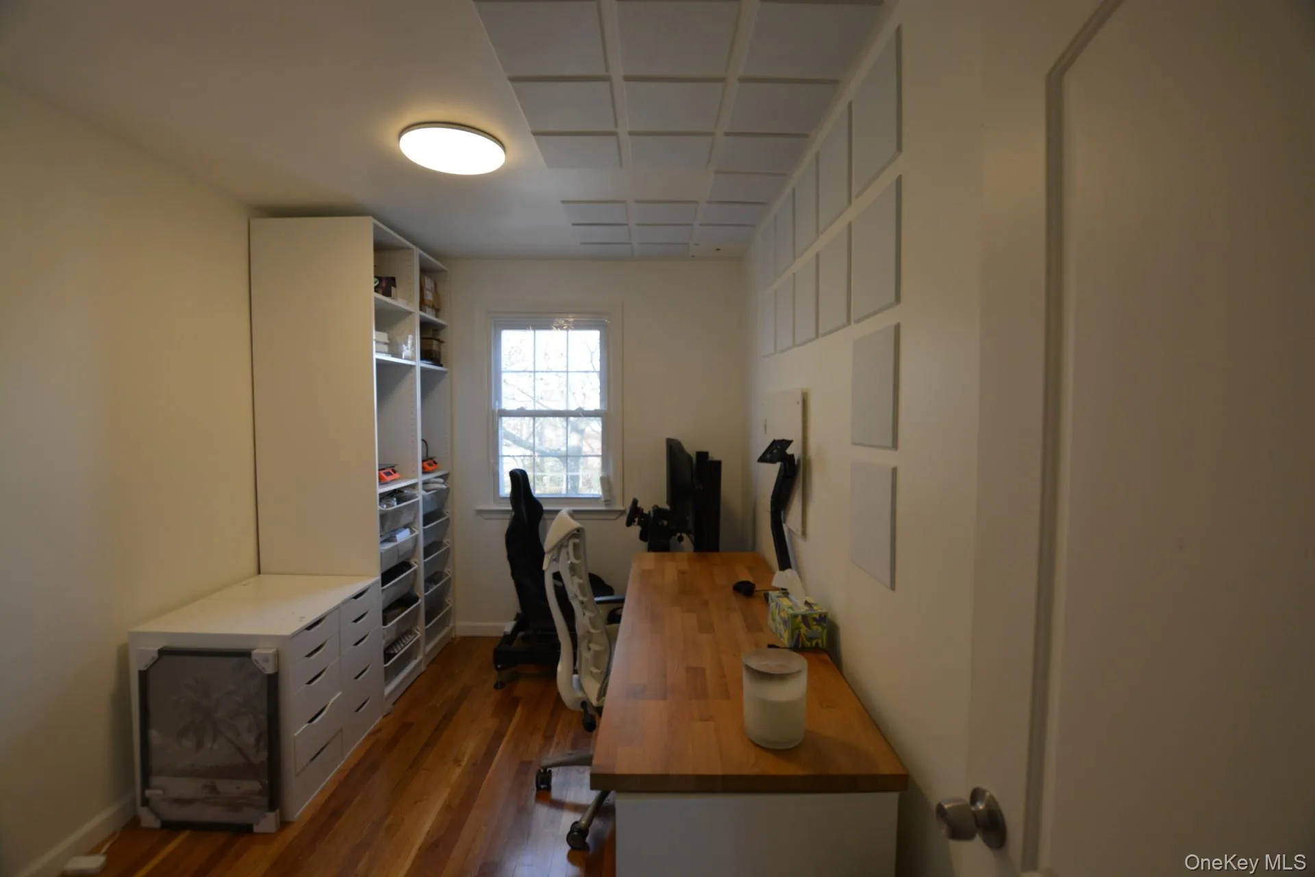 Office featuring dark wood-type flooring and baseboards Office featuring dark wood-type flooring and baseboards