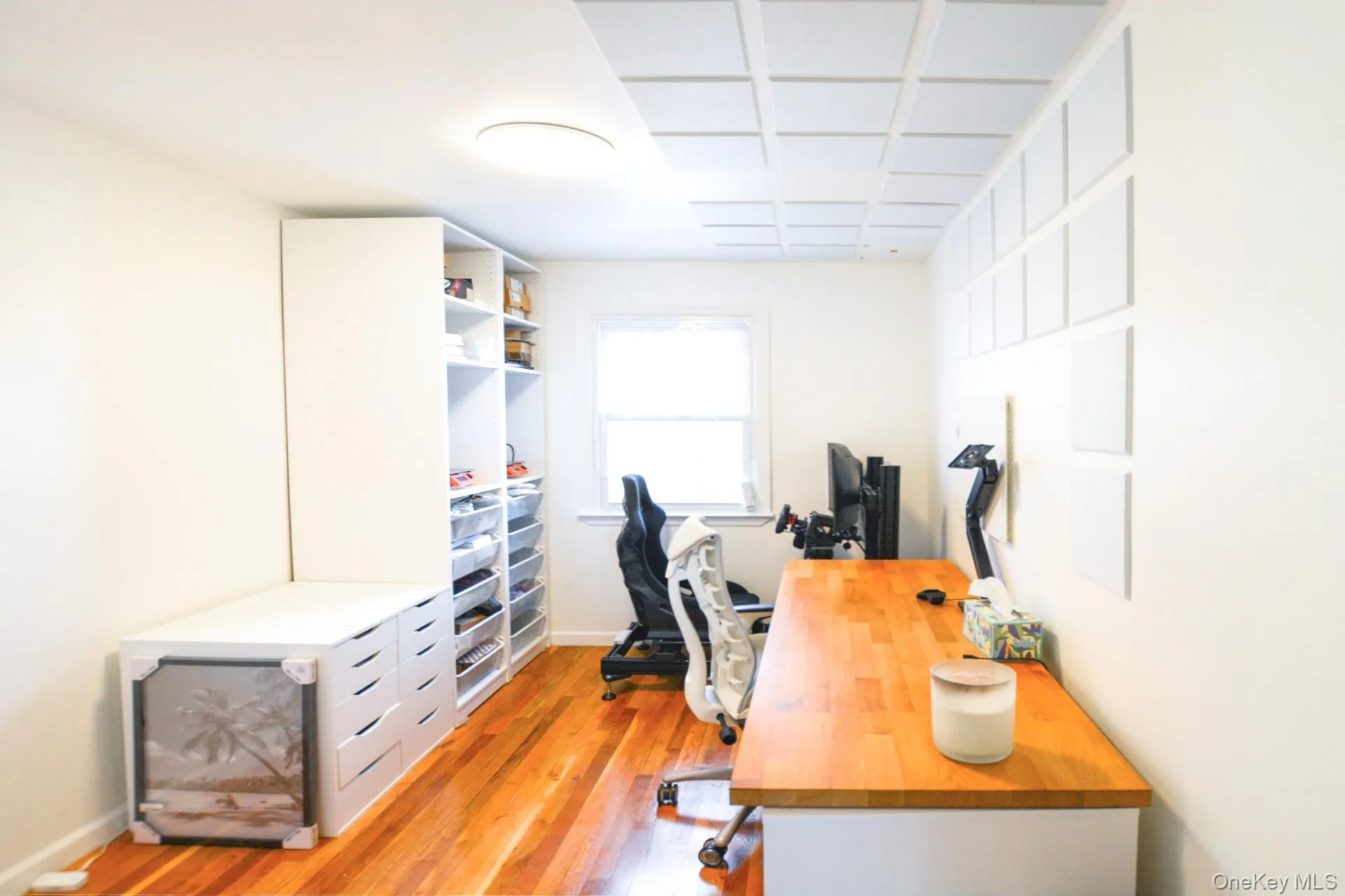 Office area with light wood-style flooring and baseboards Office area with light wood-style flooring and baseboards
