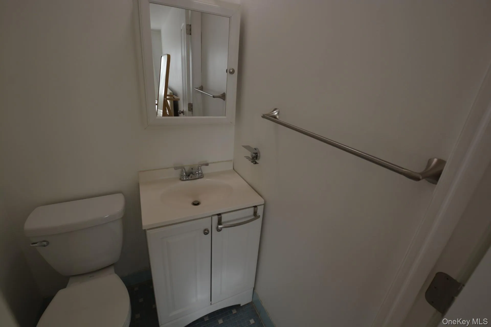 Half bath with vanity and toilet Half bath with vanity and toilet