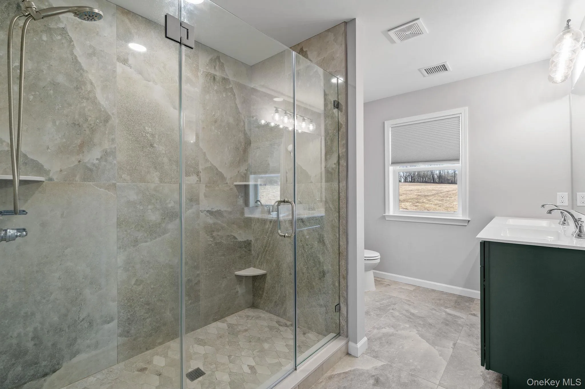 Full bath with a stall shower and double vanity Full bath with a stall shower and double vanity