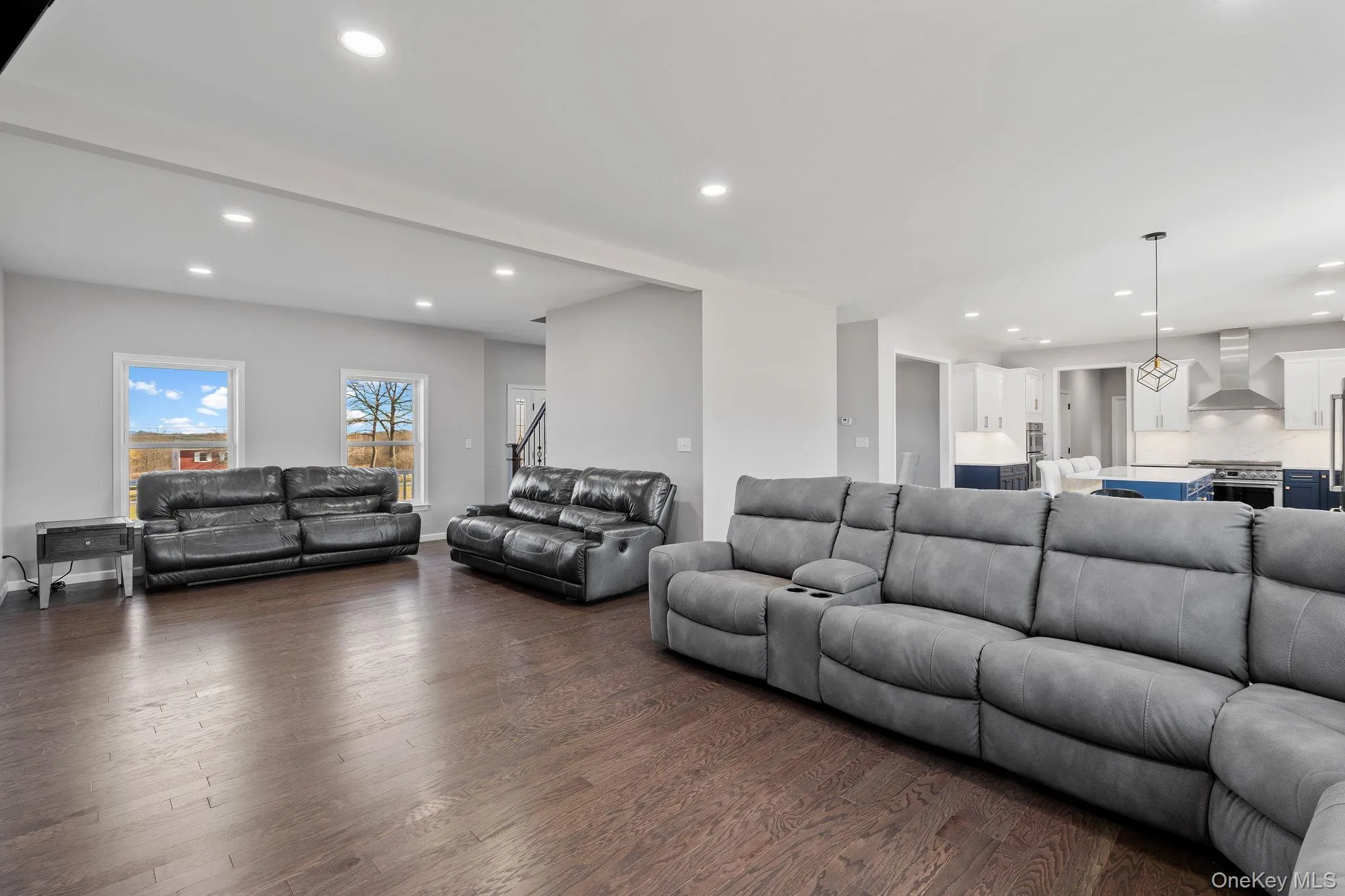Living area featuring recessed lighting and wood finished floors Living area featuring recessed lighting and wood finished floors