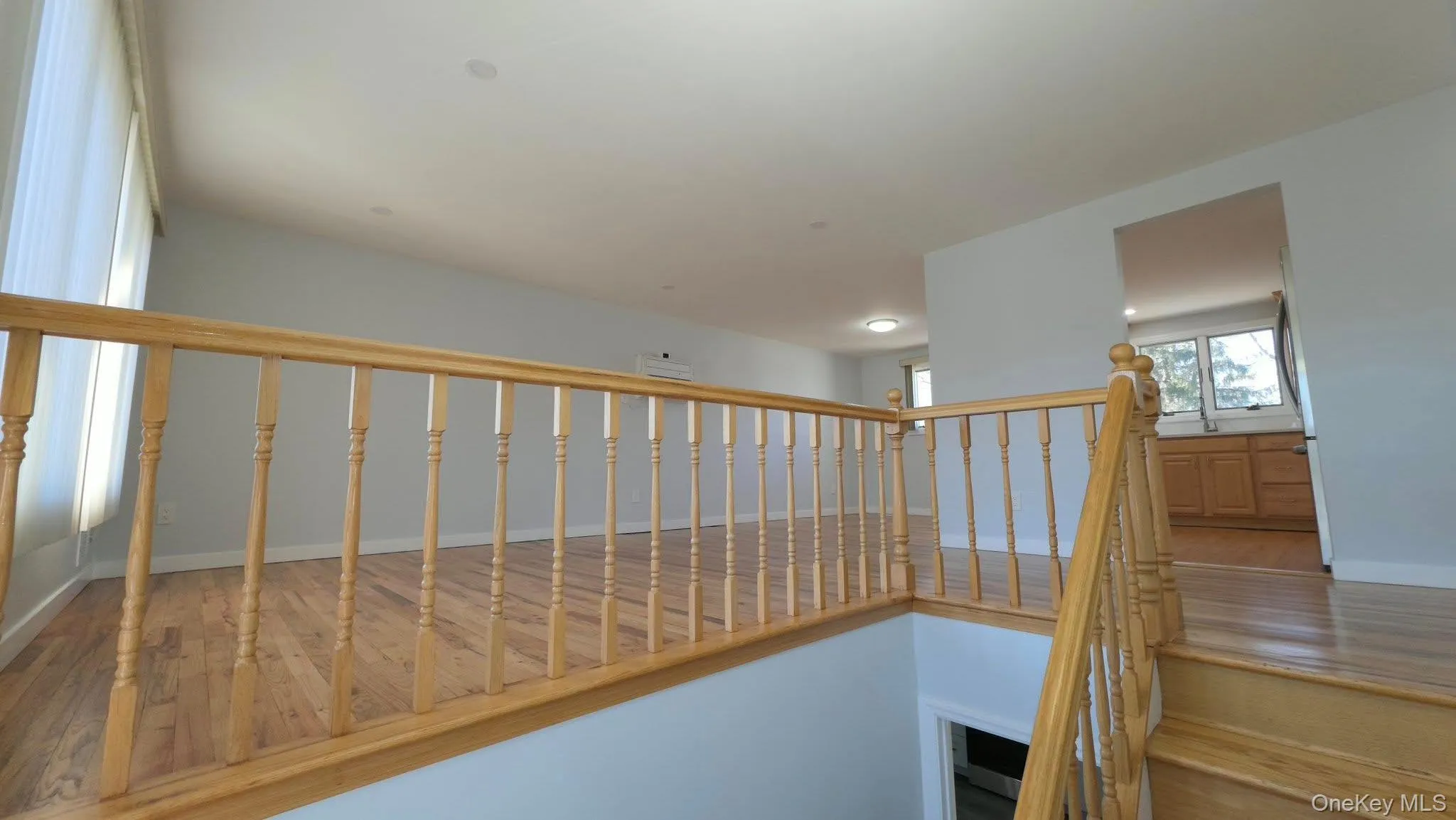Stairway featuring wood-type flooring Stairway featuring wood-type flooring