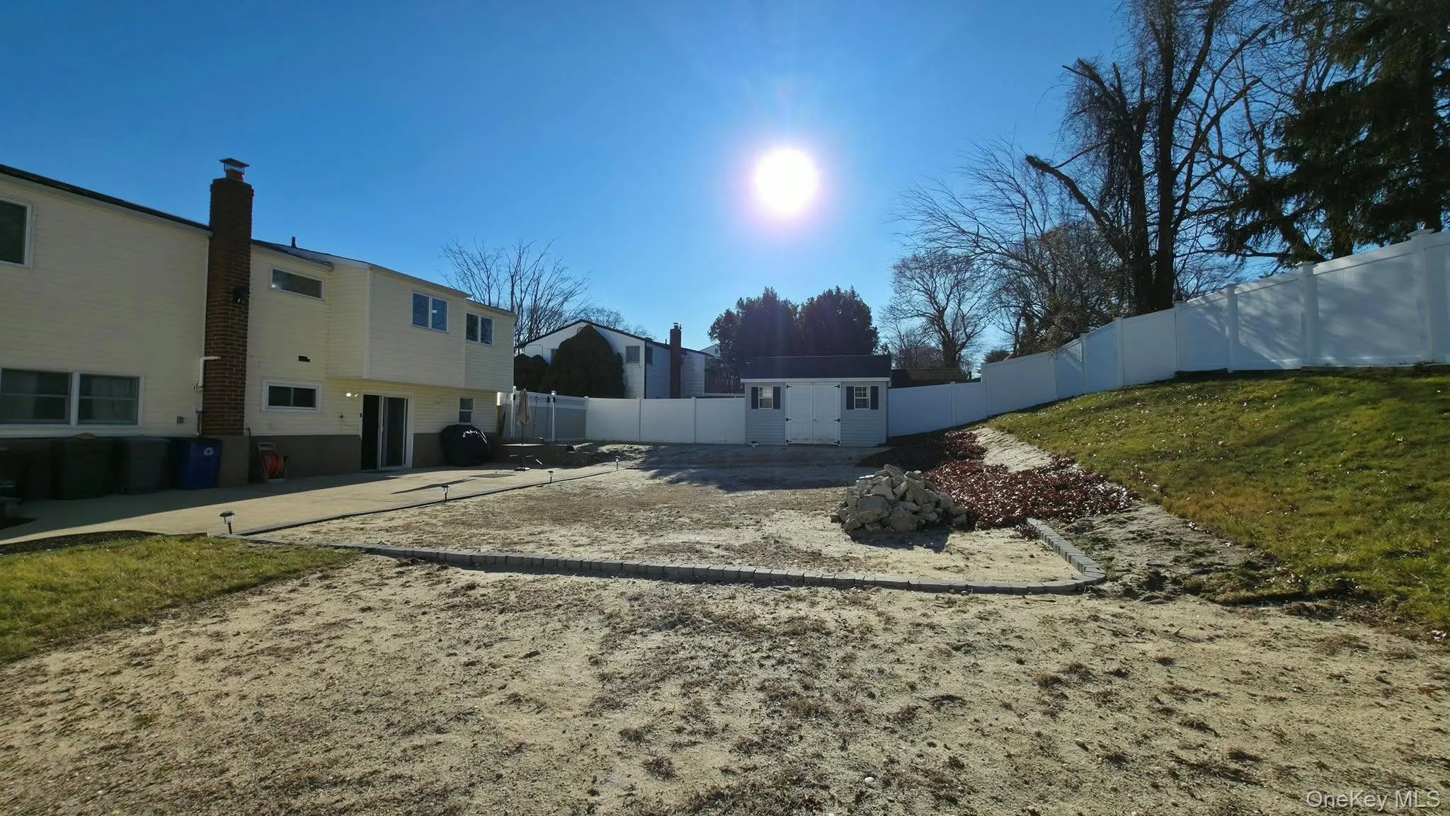 Fenced backyard featuring an outbuilding Fenced backyard featuring an outbuilding
