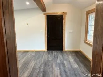 Unfurnished room with wood finished floors and recessed lighting Unfurnished room with wood finished floors and recessed lighting