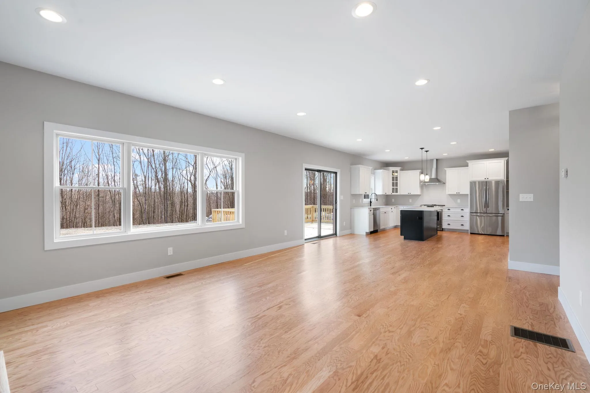 Unfurnished living room with recessed lighting and light wood finished floors Unfurnished living room with recessed lighting and light wood finished floors