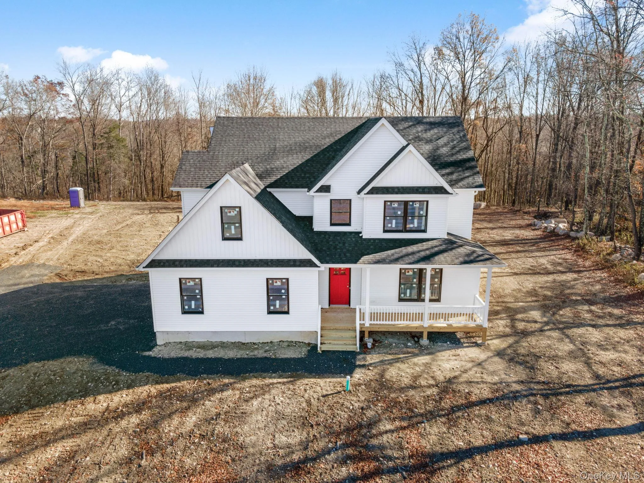 View of front of property with a shingled roof and covered porch View of front of property with a shingled roof and covered porch
