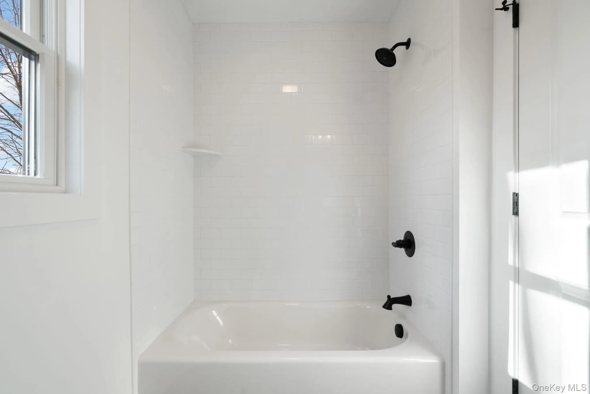 Bathroom featuring shower / washtub combination Bathroom featuring shower / washtub combination