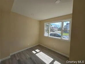 Empty room featuring dark wood-type flooring Empty room featuring dark wood-type flooring