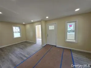 Foyer entrance featuring wood finished floors and recessed lighting Foyer entrance featuring wood finished floors and recessed lighting
