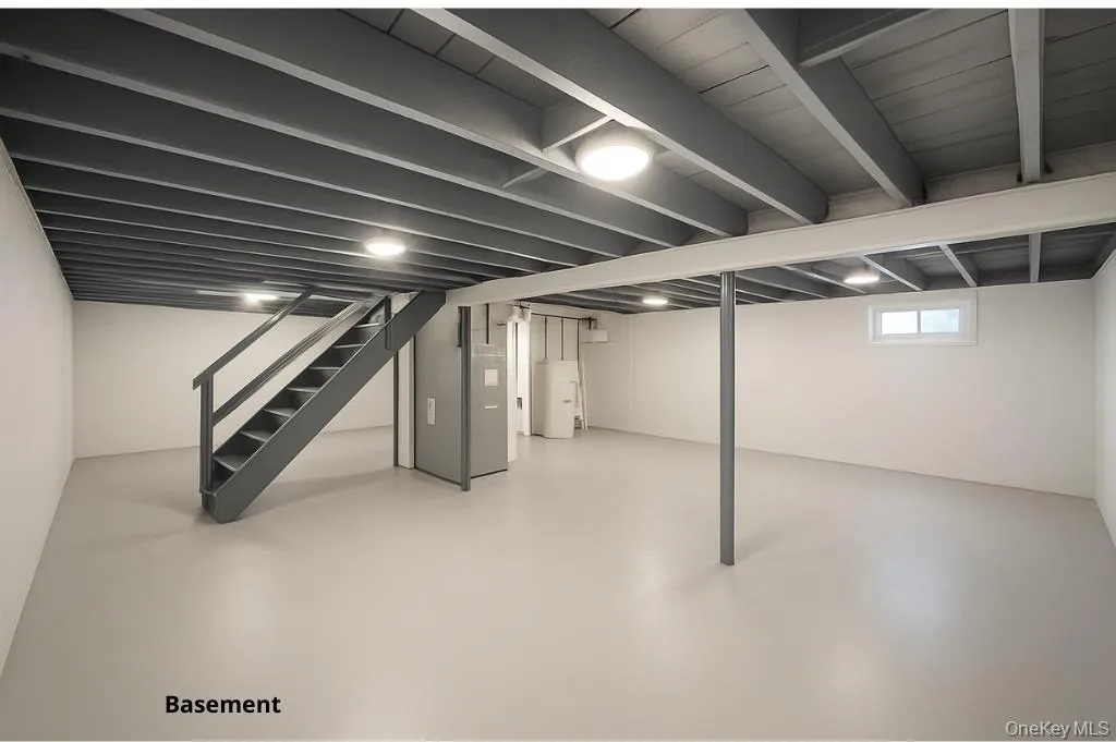 Below grade area featuring stairway Below grade area featuring stairway