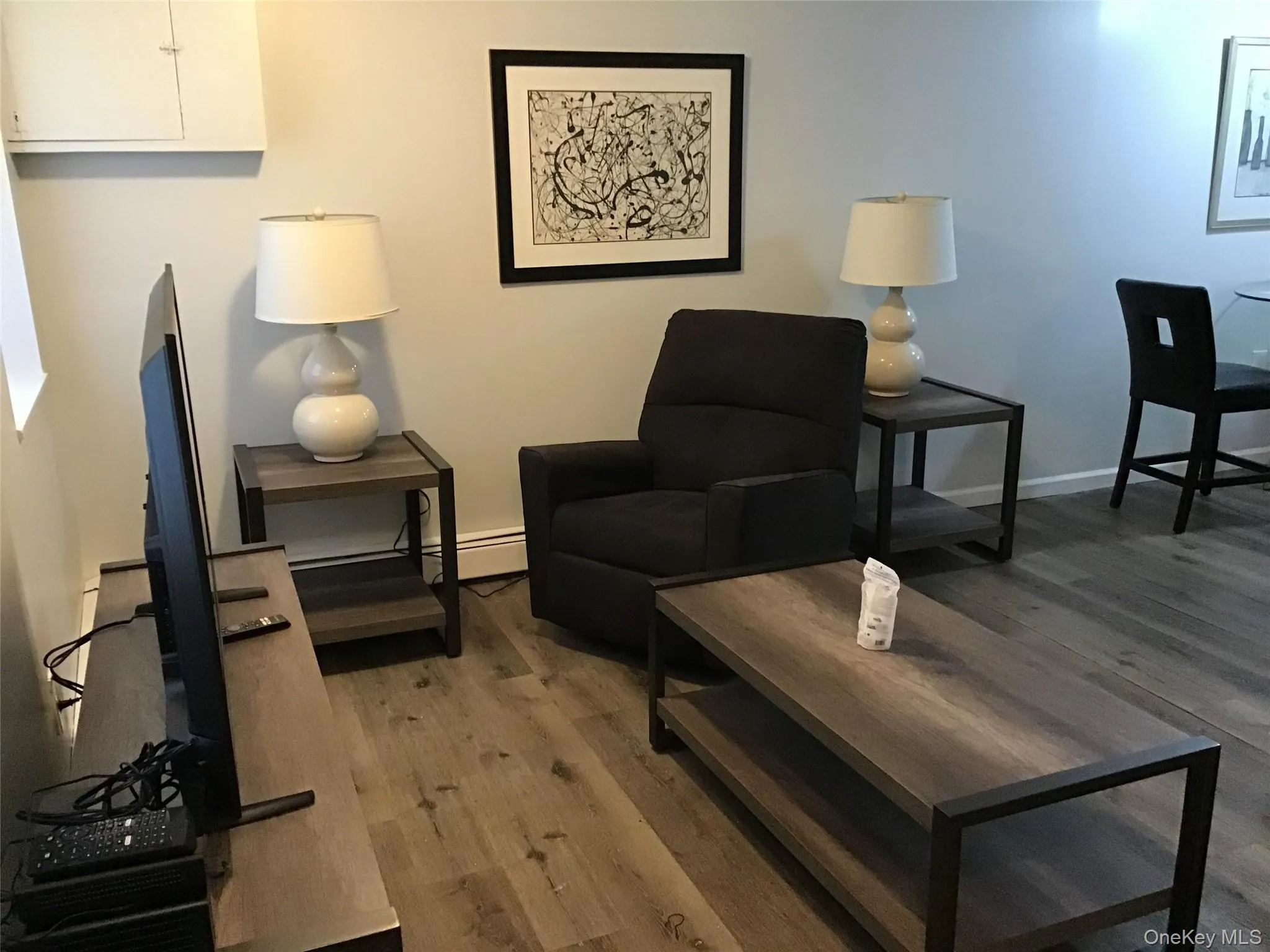 Living area featuring light wood finished floors Living area featuring light wood finished floors