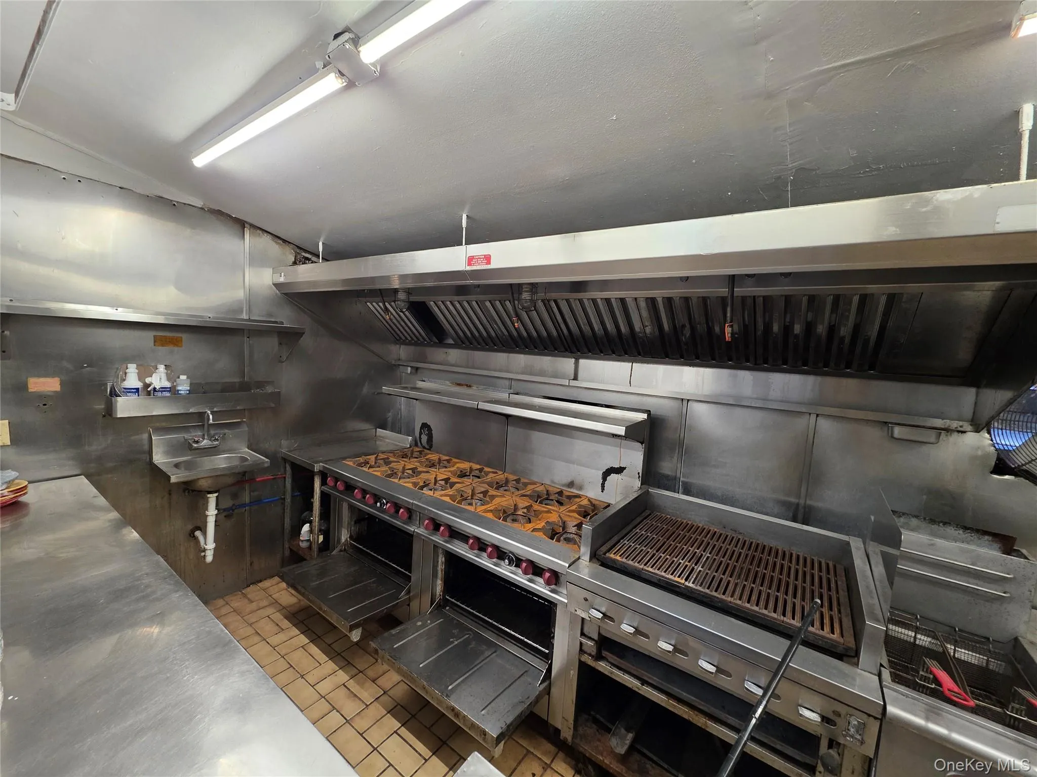 Kitchen featuring stainless steel countertops and extractor fan Kitchen featuring stainless steel countertops and extractor fan