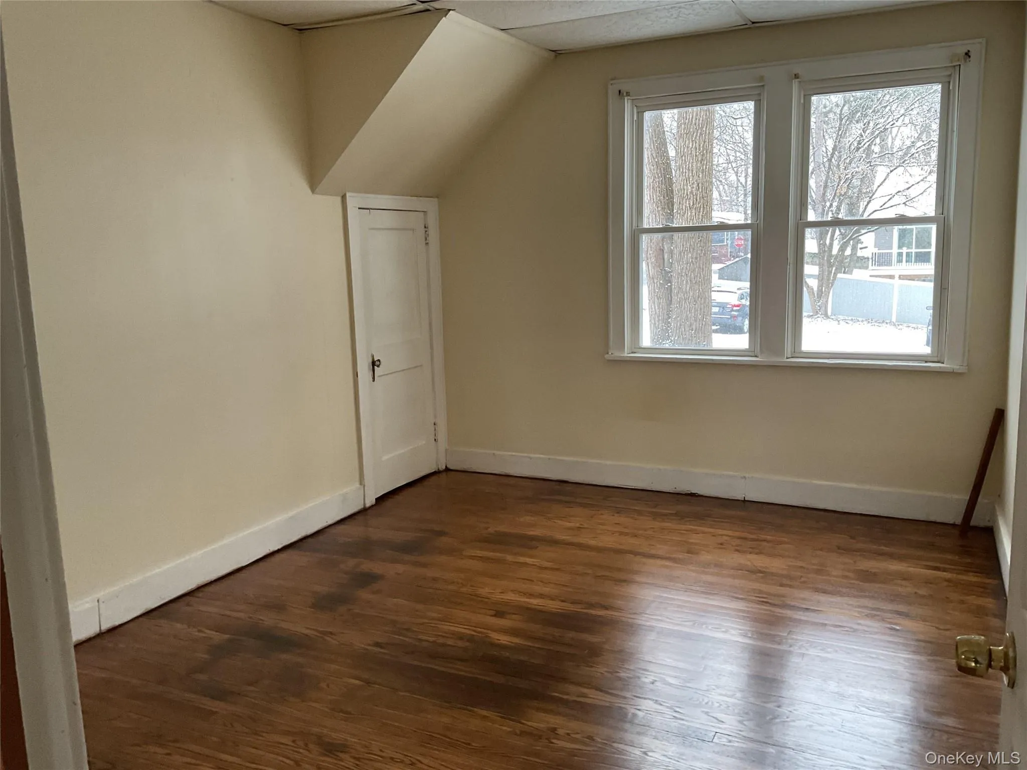 Bonus room featuring dark wood finished floors Bonus room featuring dark wood finished floors