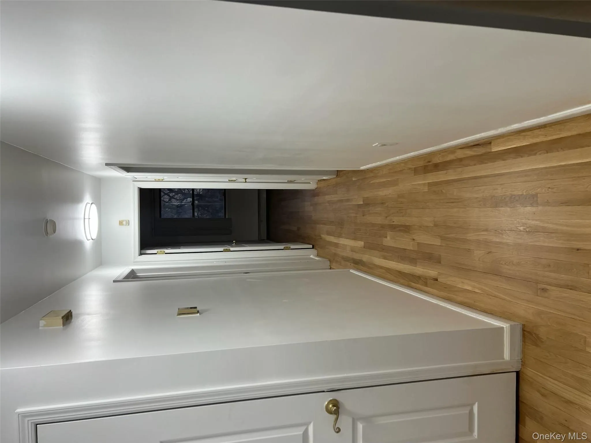 Hall featuring light wood-style floors and baseboards Hall featuring light wood-style floors and baseboards