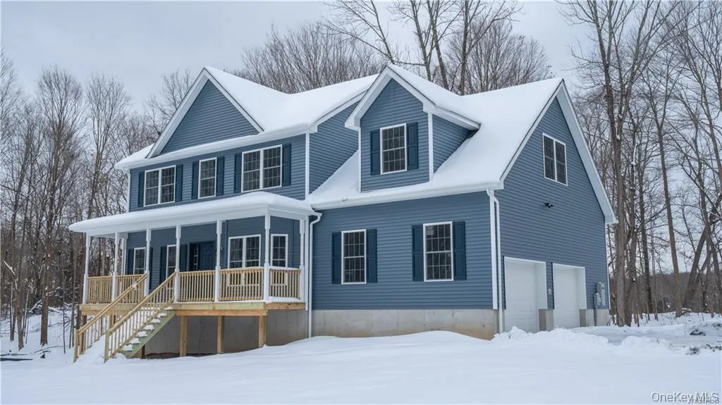 View of front of house featuring a garage, covered porch, and stairway View of front of house featuring a garage, covered porch, and stairway