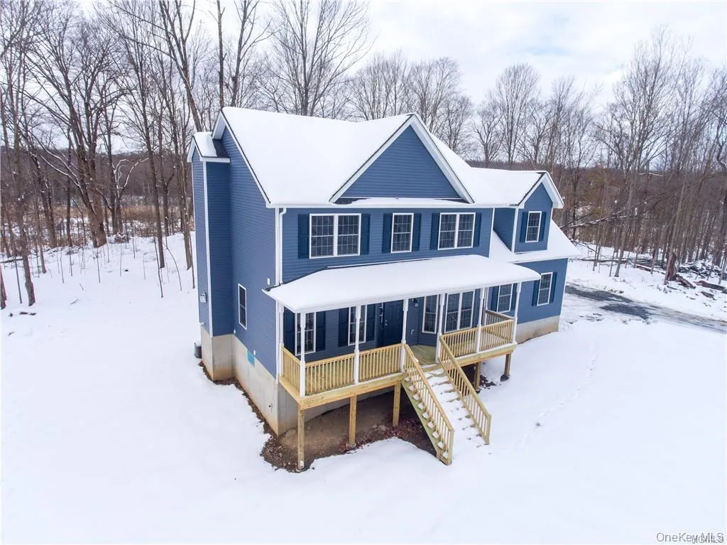 View of front of home with stairs and a porch View of front of home with stairs and a porch