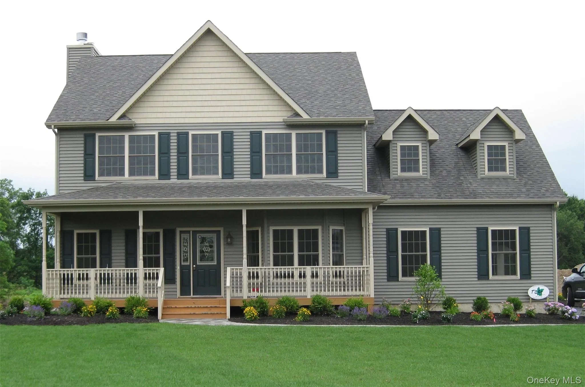 View of front of property featuring a porch, roof with shingles, and a front lawn View of front of property featuring a porch, roof with shingles, and a front lawn