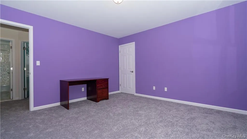 Unfurnished bedroom featuring carpet and baseboards Unfurnished bedroom featuring carpet and baseboards