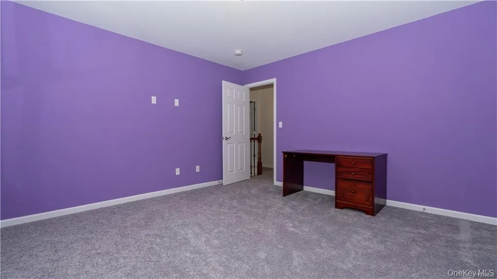 Unfurnished bedroom with baseboards and carpet floors Unfurnished bedroom with baseboards and carpet floors