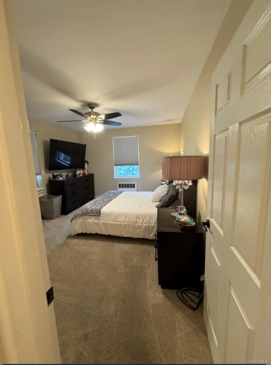 Bedroom featuring carpet and a ceiling fan Bedroom featuring carpet and a ceiling fan