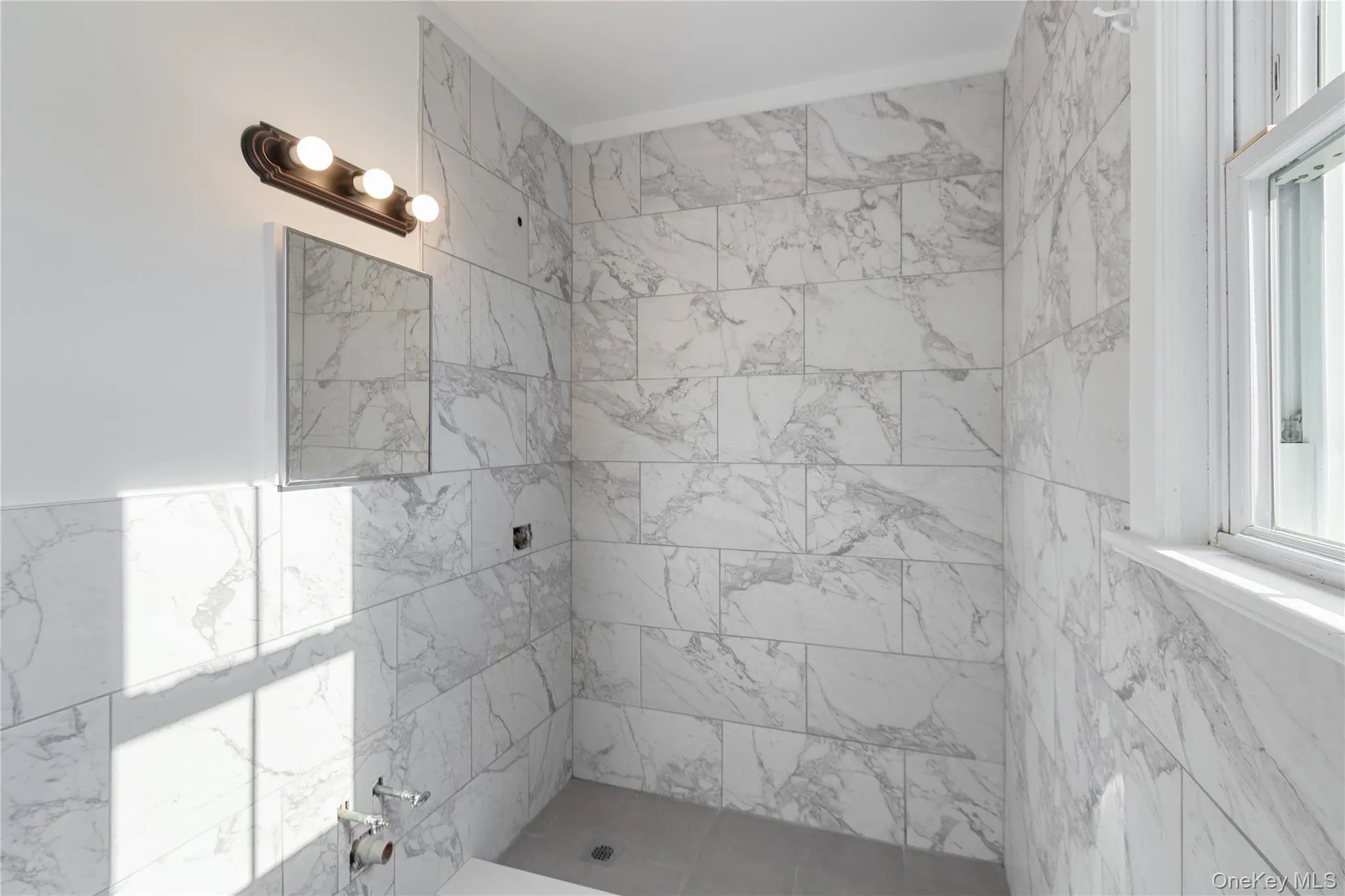 Bathroom with tiled shower Bathroom with tiled shower