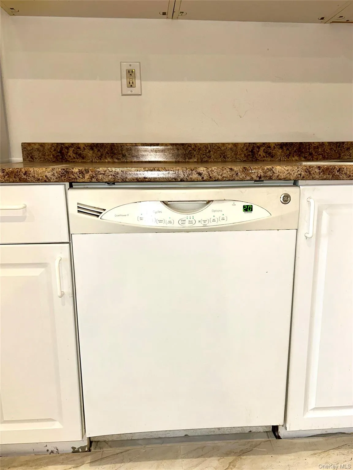 Kitchen view of dishwasher and white cabinetry Kitchen view of dishwasher and white cabinetry