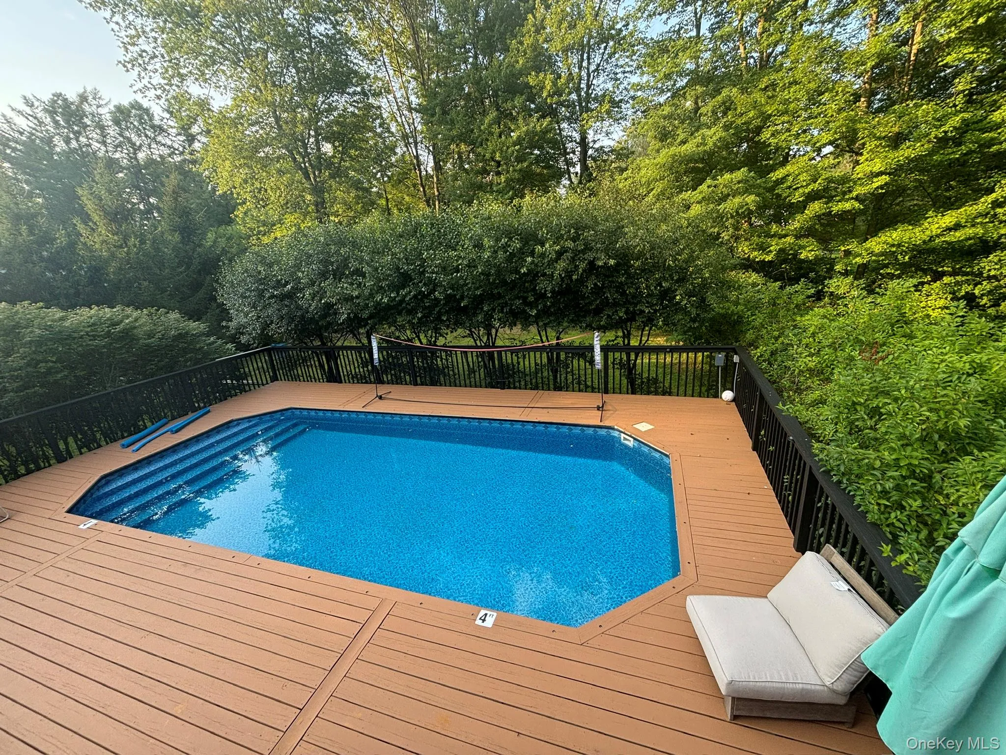 View of pool with a deck View of pool with a deck