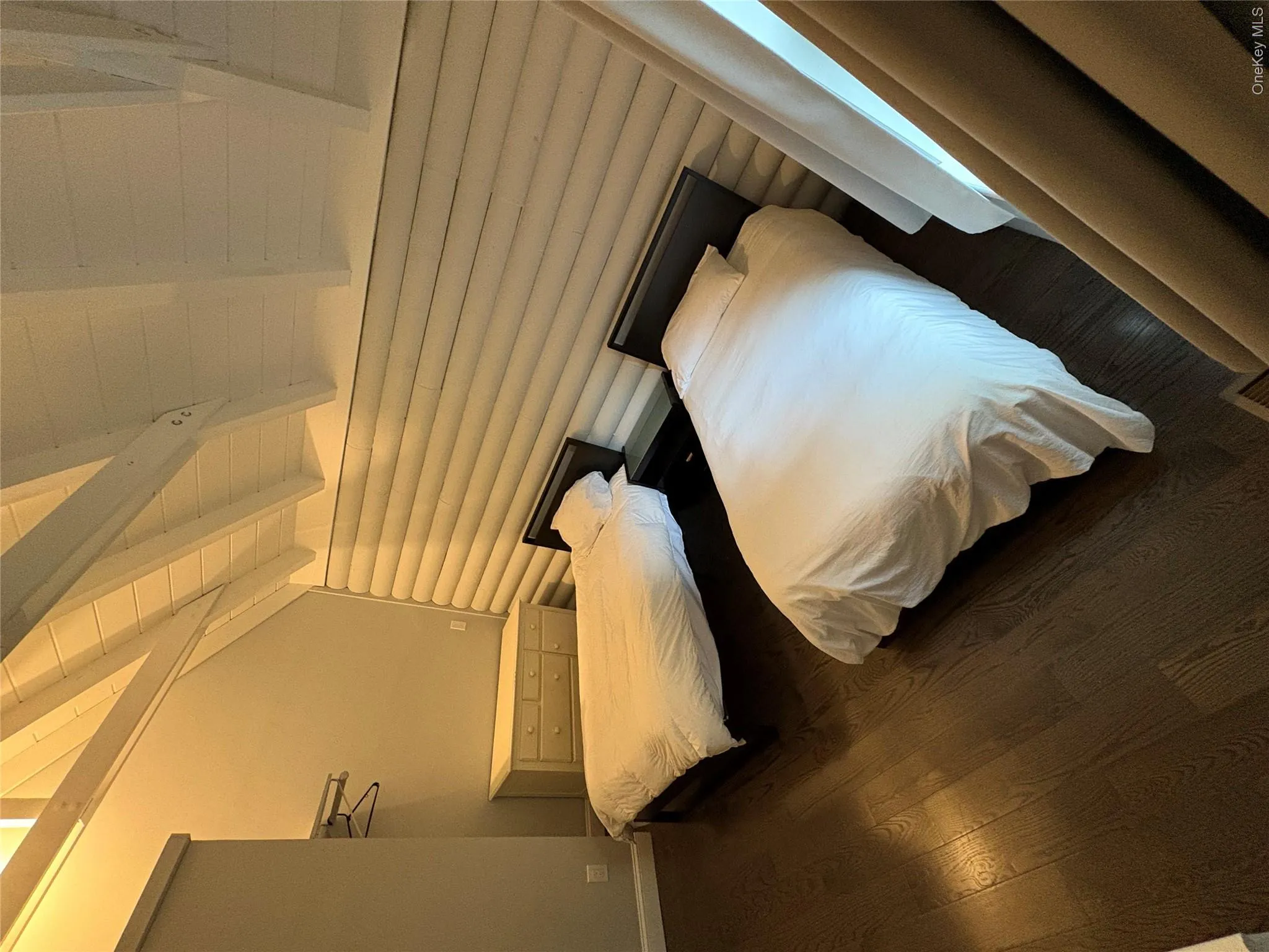 Bedroom featuring dark wood-style flooring Bedroom featuring dark wood-style flooring
