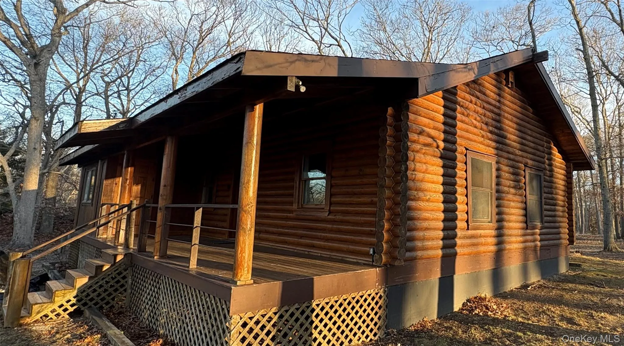 View of side of home featuring log siding and covered porch View of side of home featuring log siding and covered porch