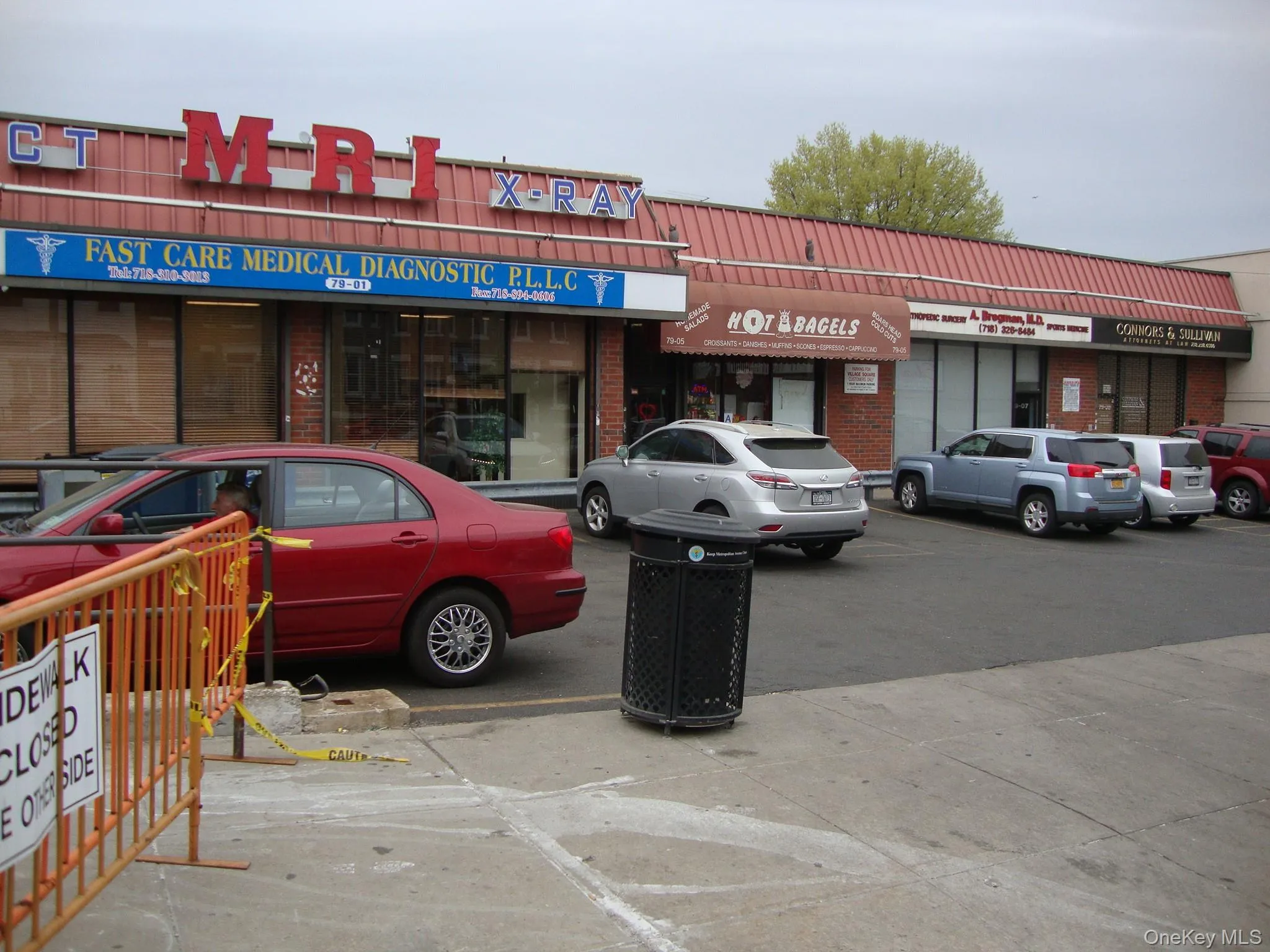 View of commercial property featuring uncovered parking View of commercial property featuring uncovered parking