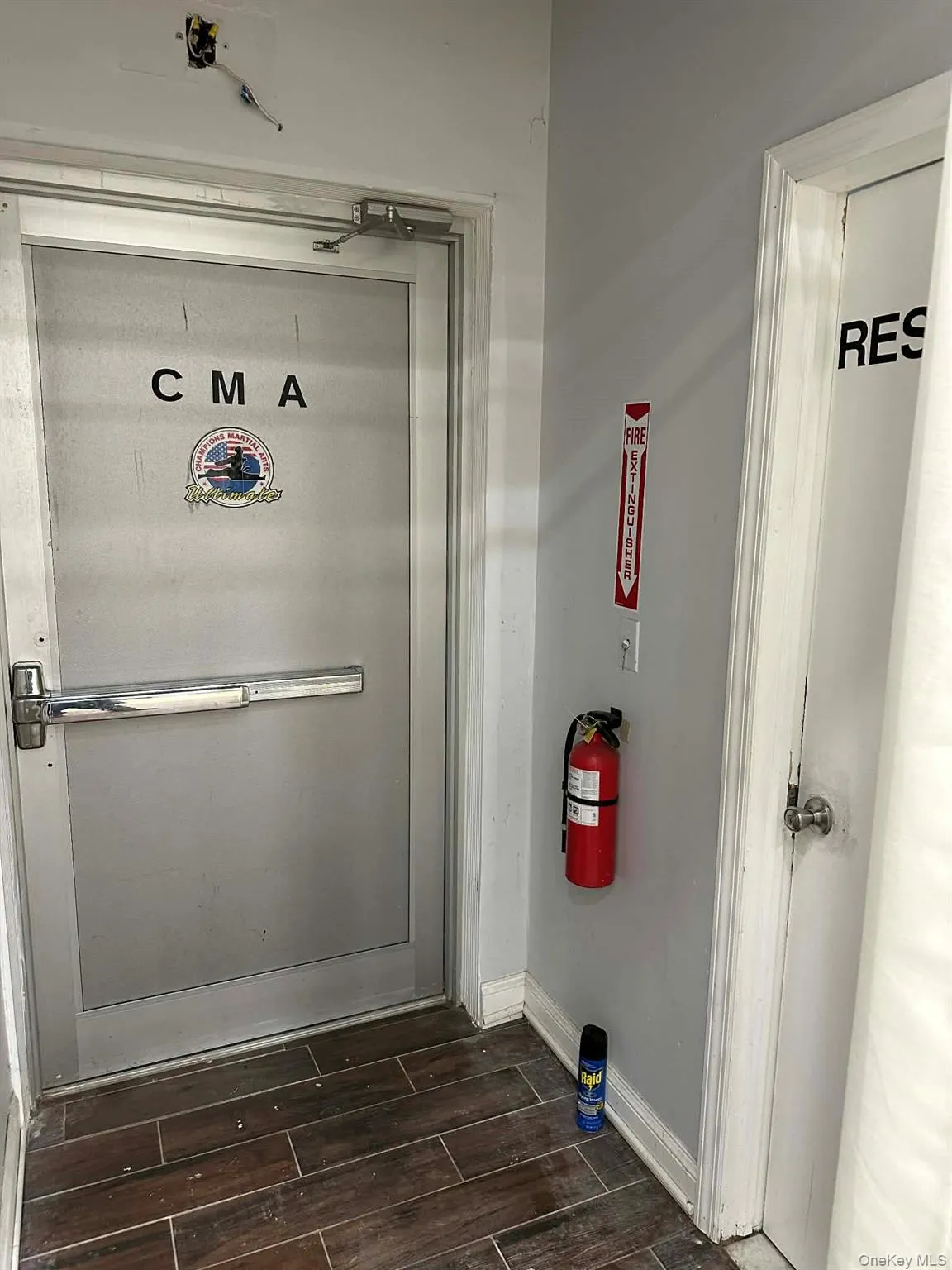 Detailed view of wood tiled floors and a fire extinguisher Detailed view of wood tiled floors and a fire extinguisher