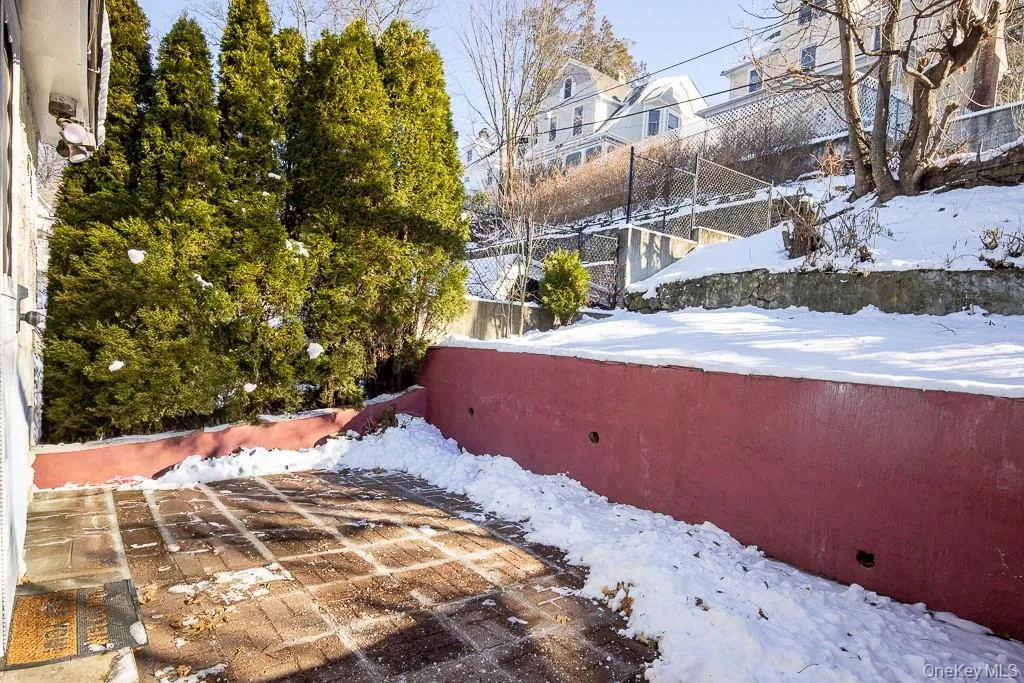 View of yard layered in snow View of yard layered in snow