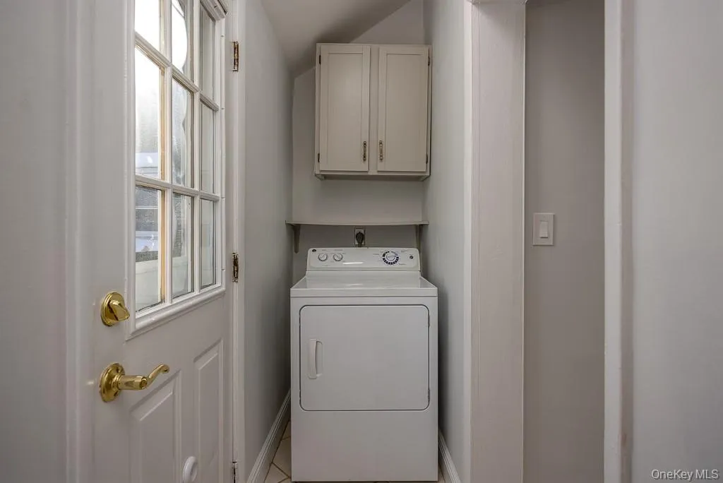 Laundry area featuring washer / dryer and cabinet space Laundry area featuring washer / dryer and cabinet space