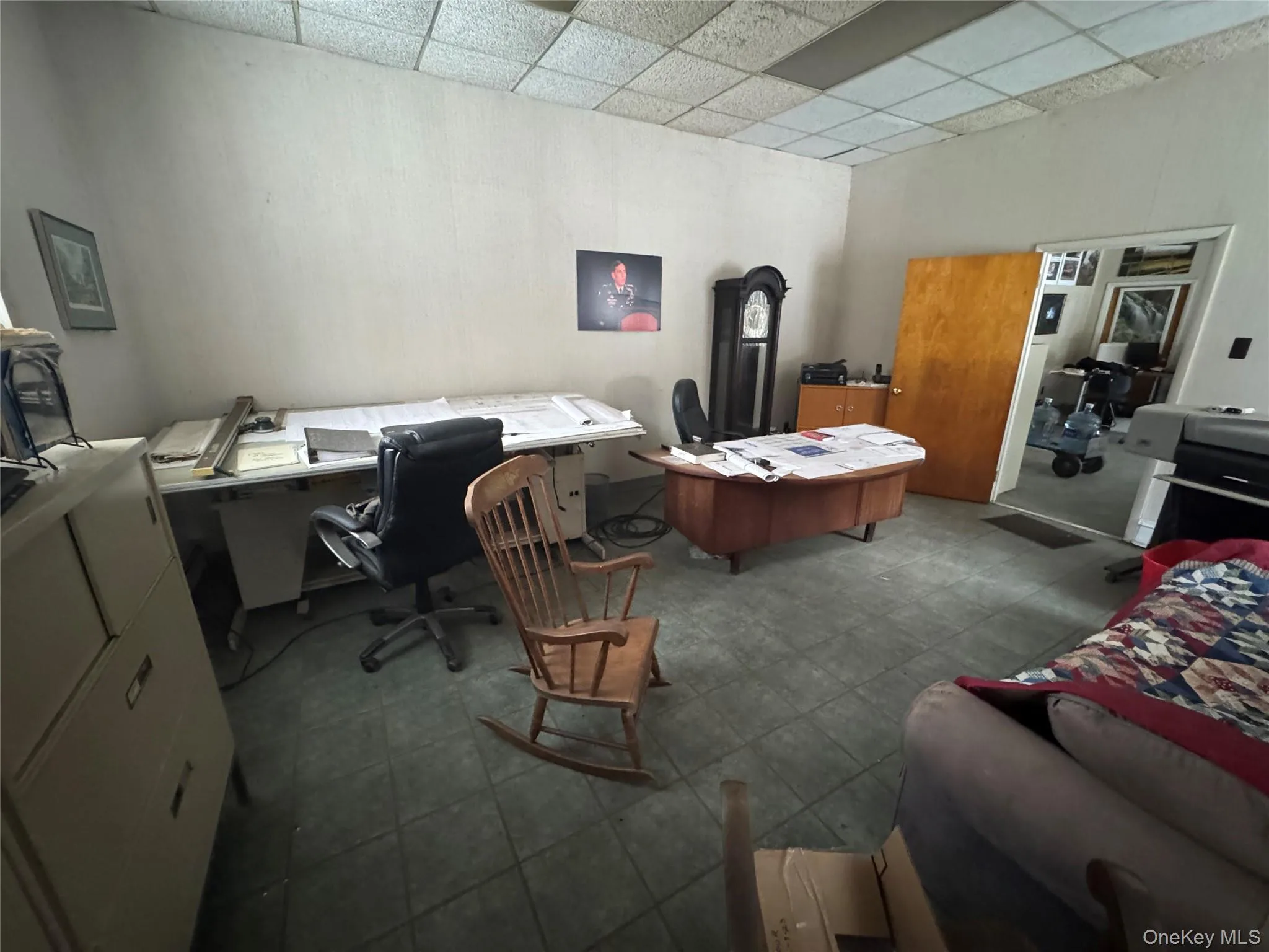 Office area with a drop ceiling Office area with a drop ceiling