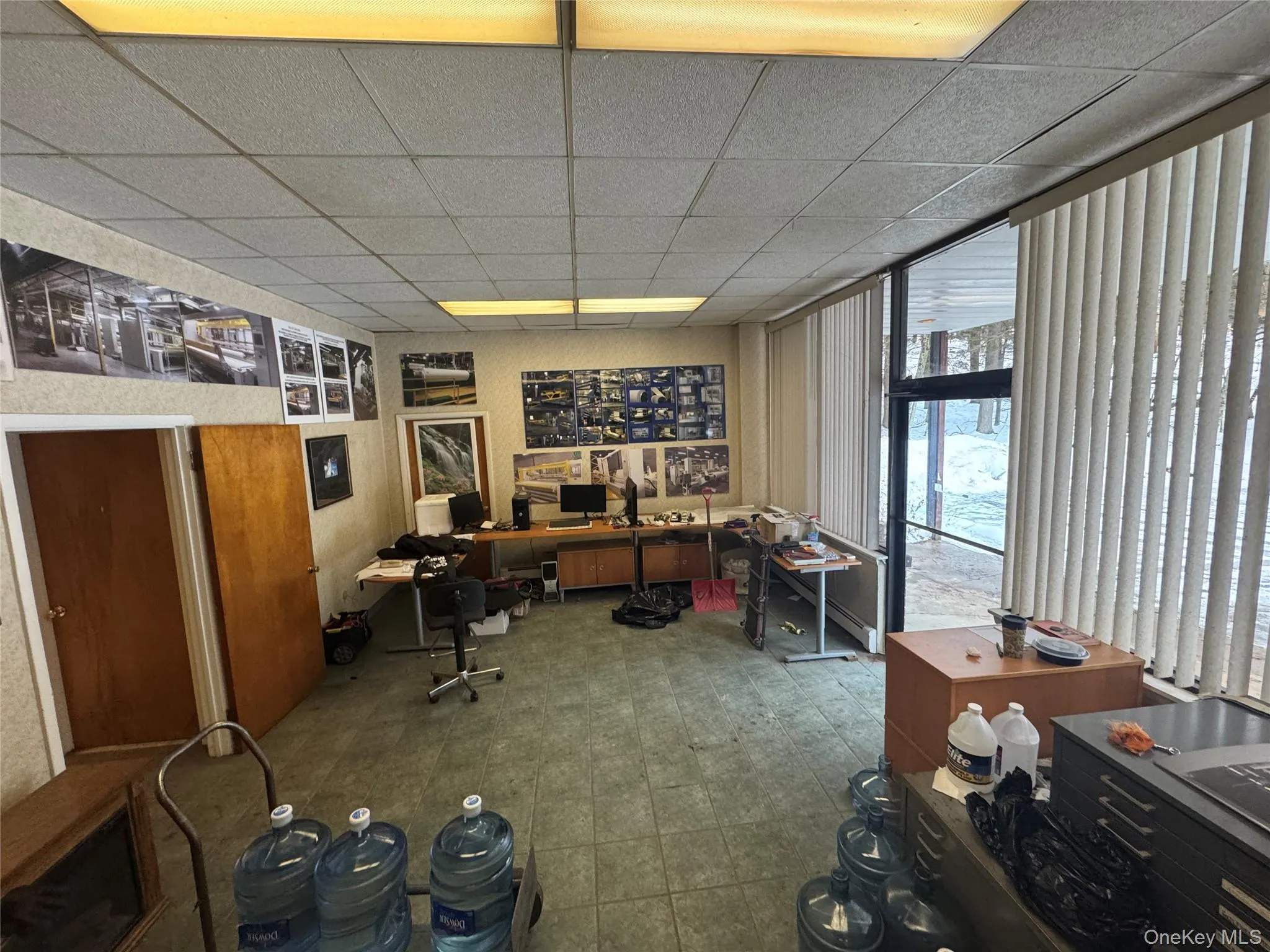 Home office featuring a drop ceiling Home office featuring a drop ceiling