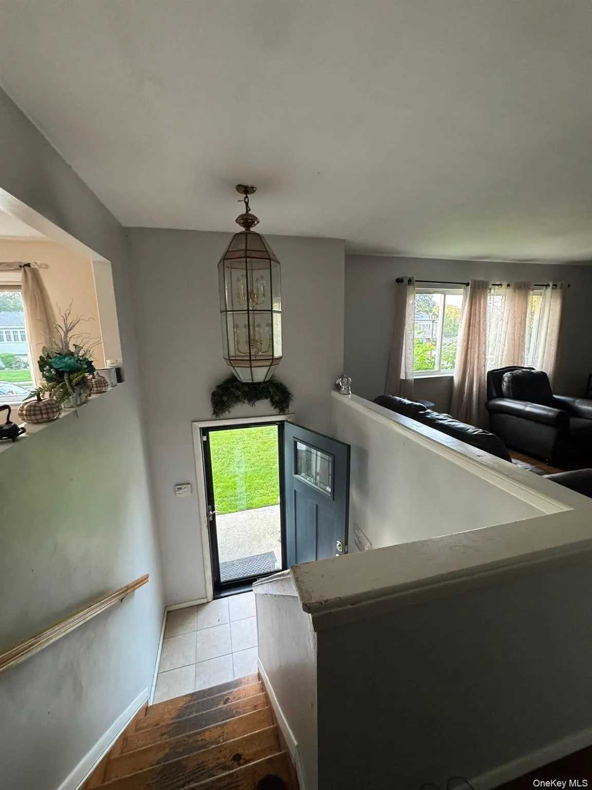 Entryway with baseboards and light wood-style floors Entryway with baseboards and light wood-style floors