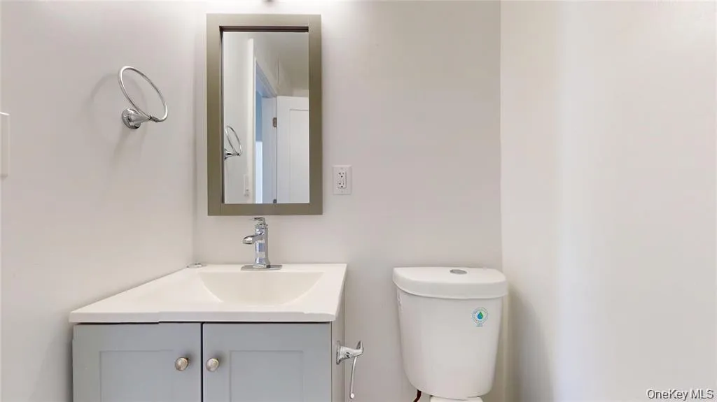 Bathroom featuring vanity and toilet Bathroom featuring vanity and toilet