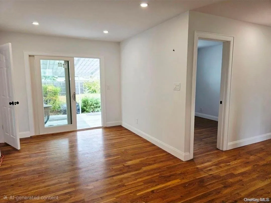 Spare room with dark wood finished floors and recessed lighting Spare room with dark wood finished floors and recessed lighting