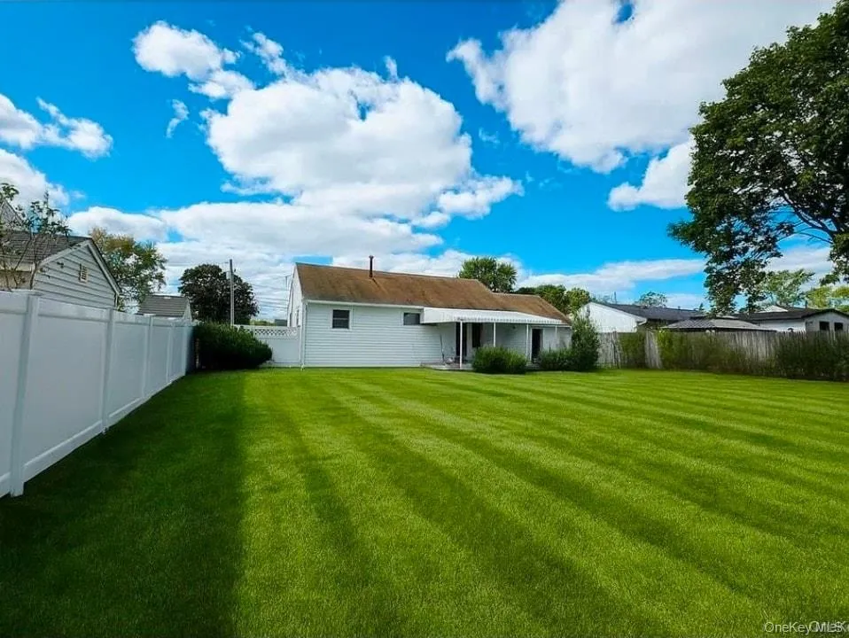Back of house featuring a fenced backyard Back of house featuring a fenced backyard