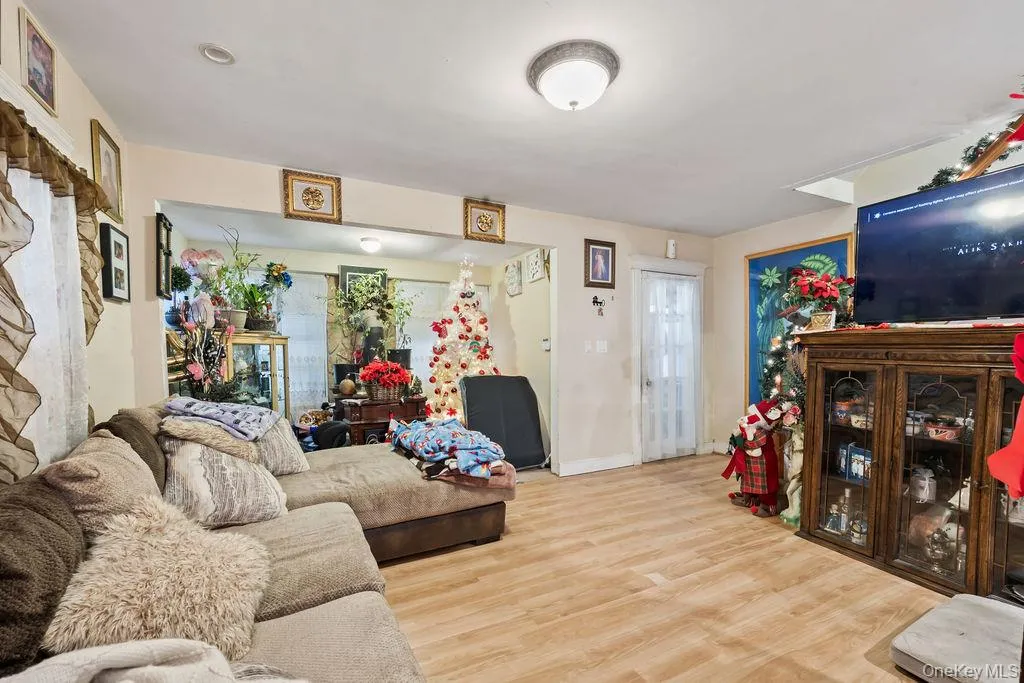 Living room featuring wood finished floors and baseboards Living room featuring wood finished floors and baseboards