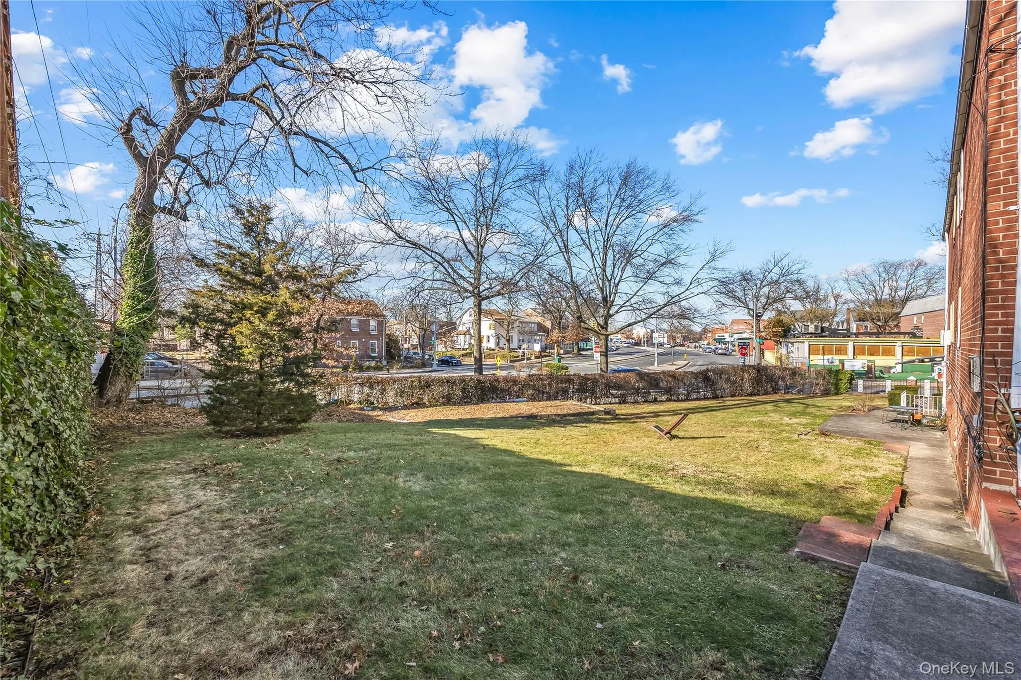 View of green lawn featuring a residential view View of green lawn featuring a residential view