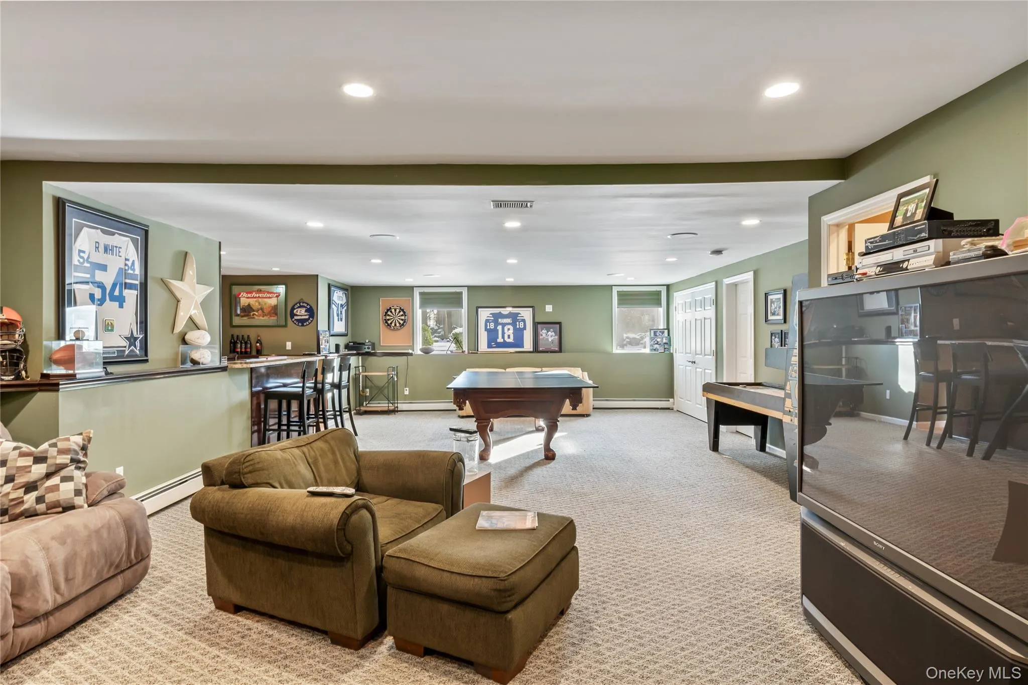 Rec room featuring carpet floors, recessed lighting, baseboard heating, and billiards Rec room featuring carpet floors, recessed lighting, baseboard heating, and billiards