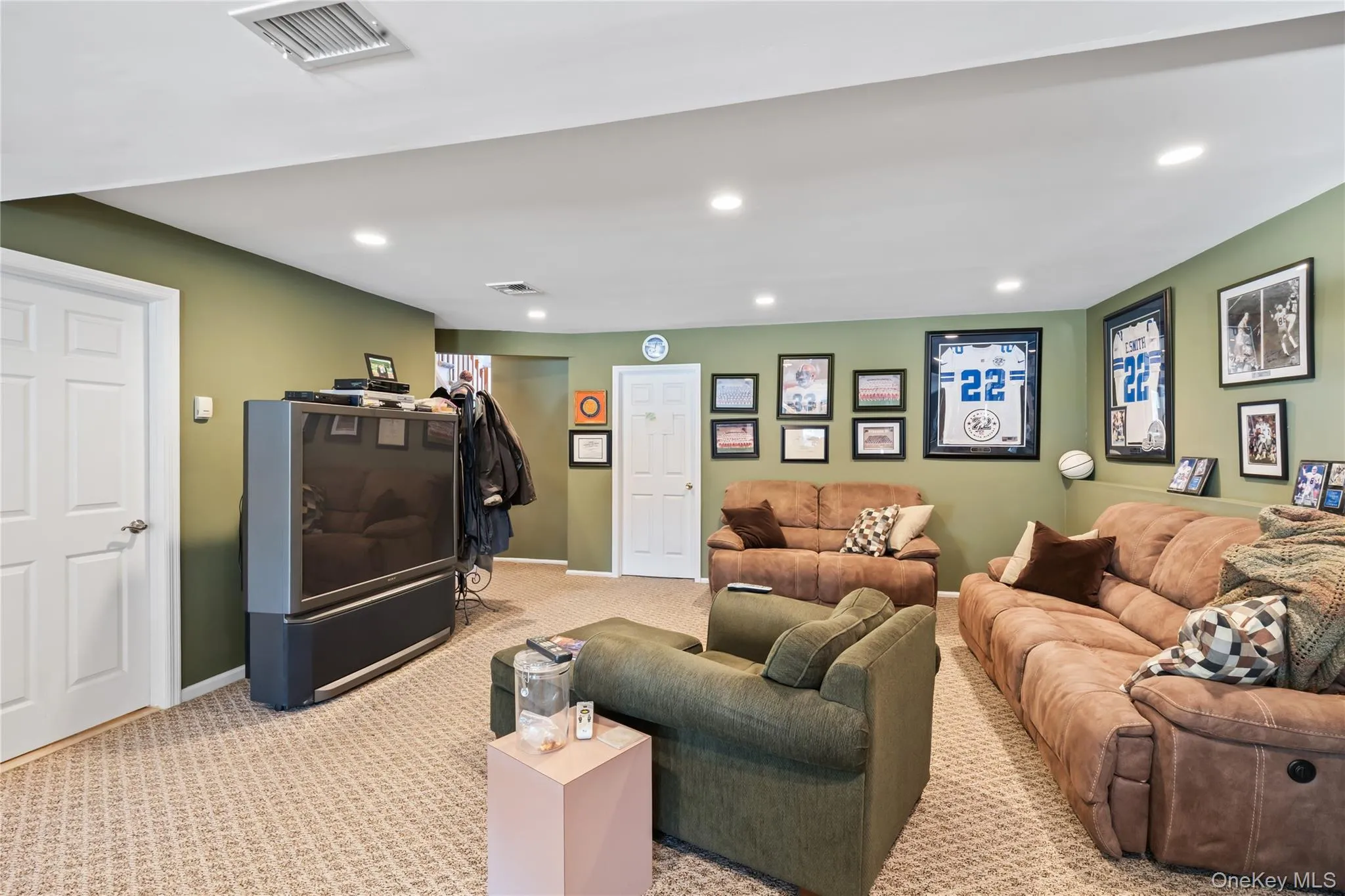 Living room with carpet floors and recessed lighting Living room with carpet floors and recessed lighting